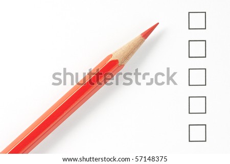 Blank survey boxes with red pencil close up. Focus on pencil tip.