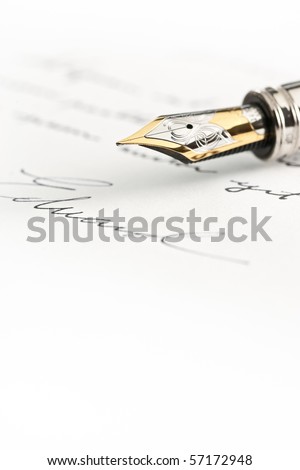 Gold fountain pen with hand written text and signature