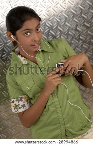 beautiful girl listening music on her portable CD player