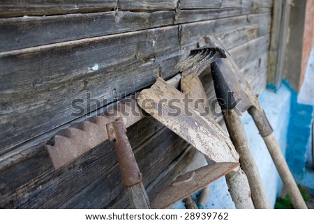 Old garden tools costing about a wooden shed