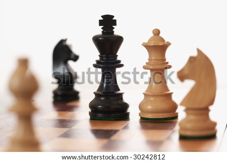 Chess game white queen challenging black king differential Focus