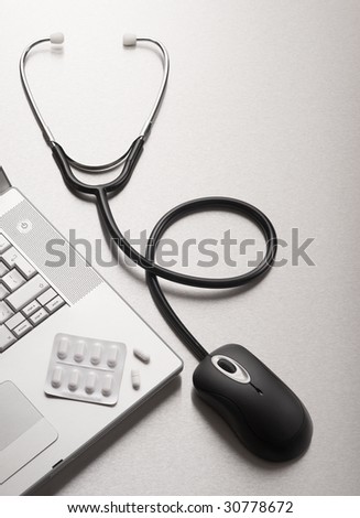 Stethoscope computer mouse medical online concept with laptop computer