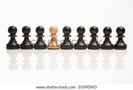 stock photo chess the odd one out white pawn in row of black pawns