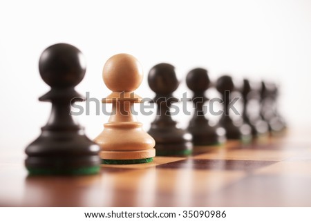 chess the odd one out white pawn in row of black pawns selective focus