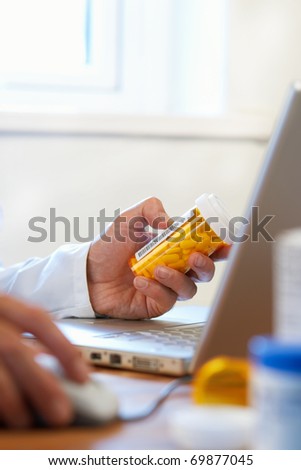 Doctor preparing online internet prescription drugs selective focus