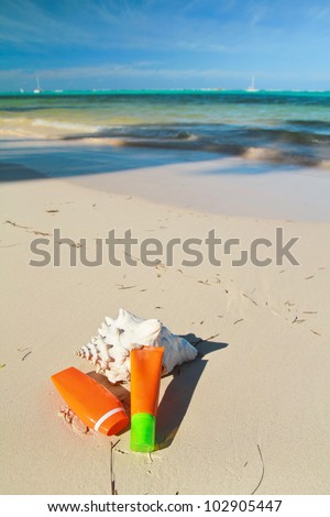 Summer protection cosmetics on a sand