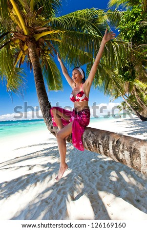 Beautiful woman in happy sitting on palm, hands up