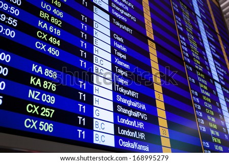 Airport arrival board in airport terminal. Travel concept.