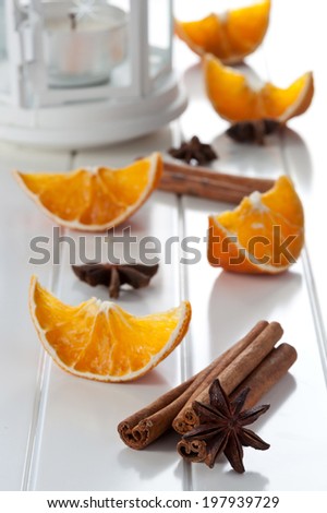Aroma spicy ingredients on white table, orange, cinnamon and anise