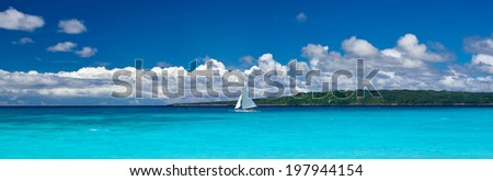 Beach with sailboat in ocean, Philippines