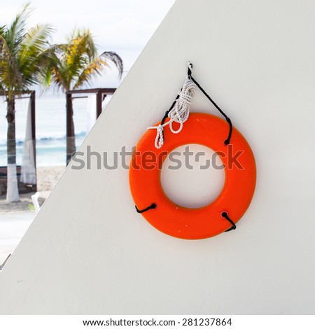 Lifebuoy ring near swimming pool at luxury resort