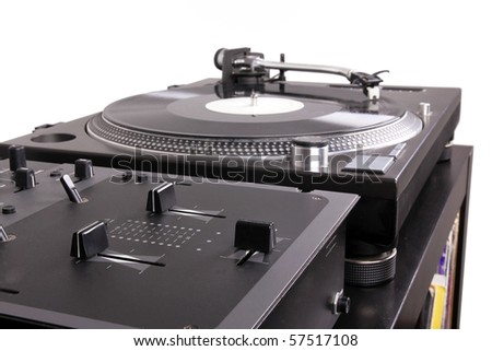 Dj mixer and turntable on black table,closed-up in studio