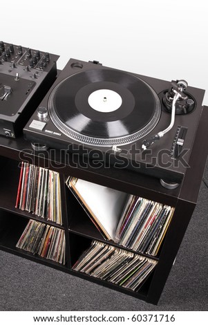 Turntable and Dj mixer on black table,closed-up in studio