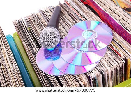 Microphone and compact disks on records, closeup