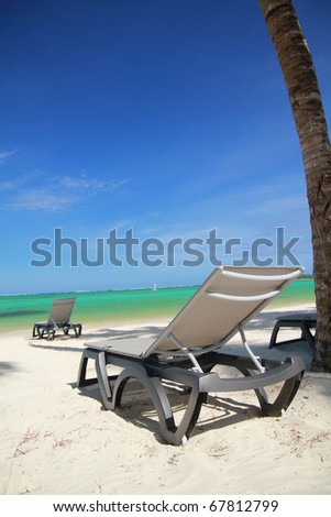 Chaise longue on tropical beach