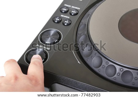 Finger on button of dj cd player, closeup