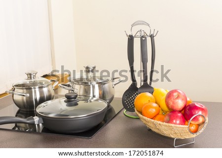 ceramic hob with pans in the kitchen