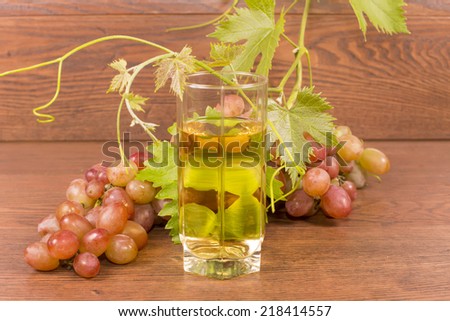 bunch of grapes with a large pink grapes