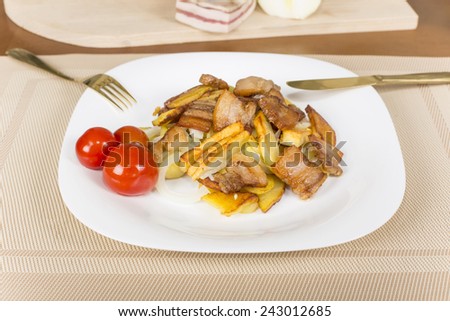 fried potatoes with bacon and pickled tomatoes