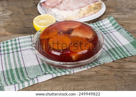the jellied fish on the table of the old rotten boards