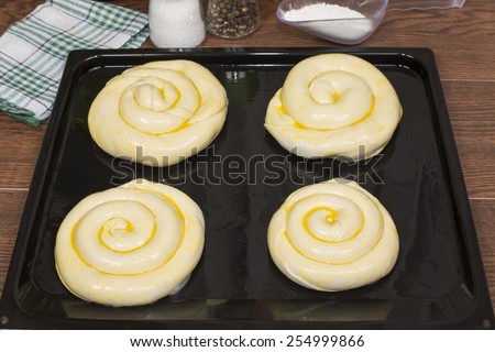 products made of raw dough - vertuta on a baking sheet