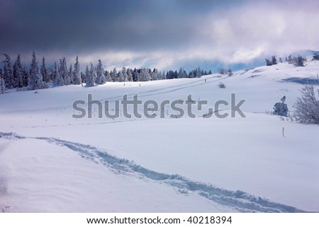 mountain path in the deep snow in winter season