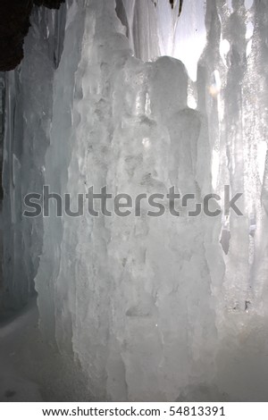 amazing iced figure under waterfall