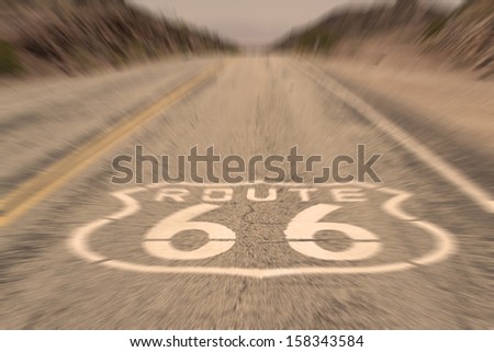 Route 66 Vintage - vertical image of route 66 road leading towards the distant horizon - motion blur