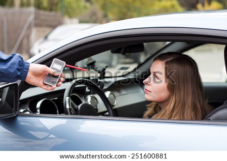 young driver woman taking her alcohol test done passed, clear. beautiful pretty girl she is