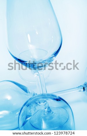 closeup of some empty wine glasses in a club
