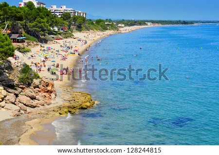 MONT-ROIG DEL CAMP, SPAIN - AUGUST 10: Vacationers in Miami Platja beaches on August 10, 2012 in Mont-roig del Camp, Spain. One of the main attractions of Miami Platja is its 12 km of coastline