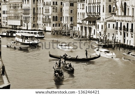 VENICE ITALY APRIL 11 A view of the Grand Canal from Rialto Bridge on April 14 1013 in Venice Italy This main canal is 3800 meter long 30- 90 meters wide with an average depth of five meters VENICE ITALY APRIL 11 A view of the Grand Canal from Rialto Bridge on April 14 1013 in Venice Italy This main canal is 3800 meter long 30- 90 meters wide with an average depth of five meters