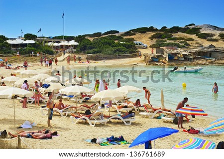 FORMENTERA, SPAIN - SEPTEMBER 18: Bathers in Ses Illetes Beach on September 18, 2012 in Formentera, Balearic Islands, Spain. Formentera is renowned across Europe for many white beaches like this