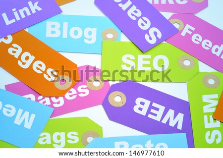 paper labels of different colors with different words about internet marketing and website ranking, such as SEO and SEM, or blog, page, web or link