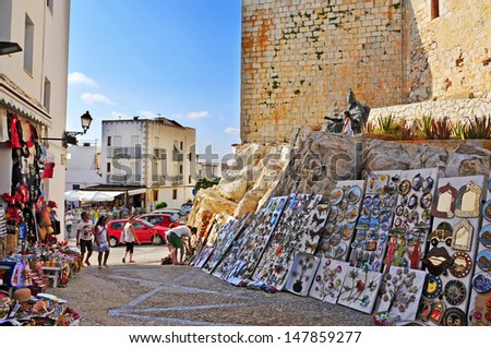 PENISCOLA, SPAIN - JULY, 26: Tourists in souvenir stores surrounding the castle, on July 26, 2013 in Peniscola, Spain. The town is a typical summer destination in the North of the Valencian Community
