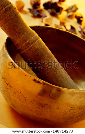closeup of a tibetan singing bowl with its mallet