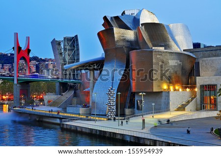 Bilbao, Spain - November 14: The Guggenheim Museum And The Estuary At Evening On November 14, 2012 In Bilbao, Spain. This Picturesque And Futuristic Museum Was Designed By Frank Ghery