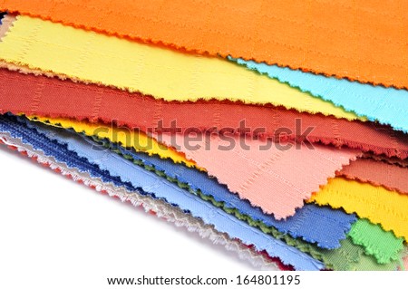 some pieces of fabric with different colors and patterns on a white background
