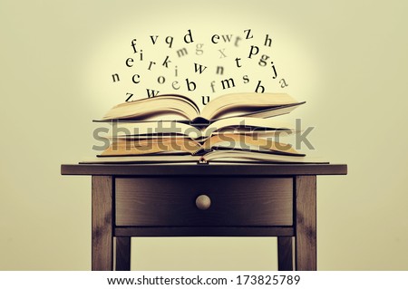 a pile of books and letters floating over them on a desk symbolizing the idea of literature or knowledge