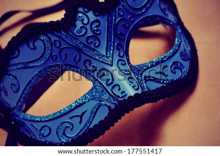 picture of an elegant blue and black carnival mask with a retro effect