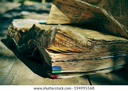 closeup of a weathered phone book