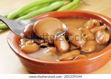 a traditional earthenware bowl with broad bean stew
