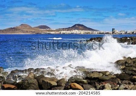 the Atlantic Ocean breaking in the rocks in the coast of Las Palmas de Gran Canaria, Spain