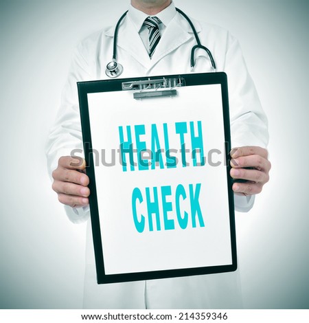 a doctor showing a clipboard with the text health check written in it