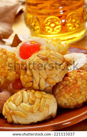 some panellets and a bottle of sweet wine, typical snack in All Saints Day in Catalonia, Spain