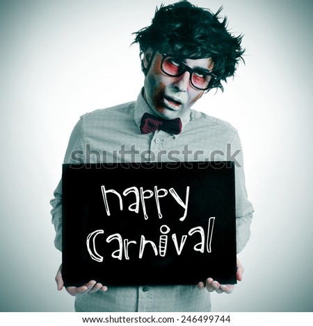 a man dressing a zombie costume with a black signboard with the text happy carnival written in it