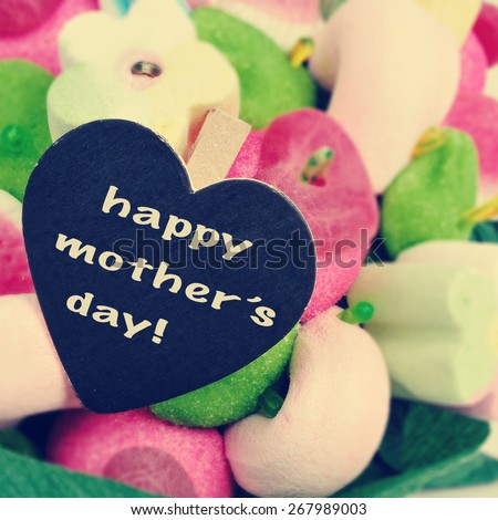 the sentence happy mothers day written in a heart-shaped blackboard on a candy bouquet