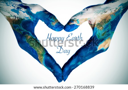 the hands of a young woman forming a heart patterned with a world map (furnished by NASA) and the text happy earth day