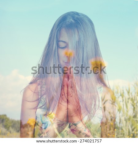 double exposure of a young brunette woman meditating and a peaceful landscape with yellow flowers