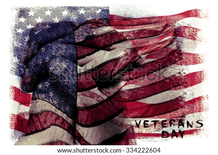 the text veterans day written in a double exposure of a flag of the United States and a closeup of the clasped hands of a man praying